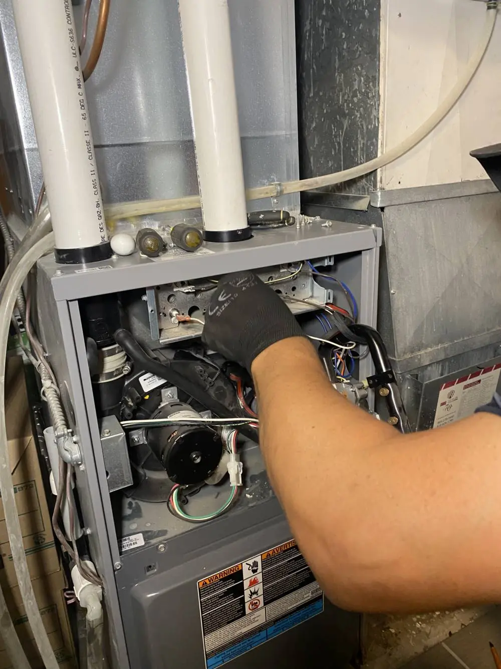 HVAC technician performing furnace repair for reliable heating – HVAC Group emergency service