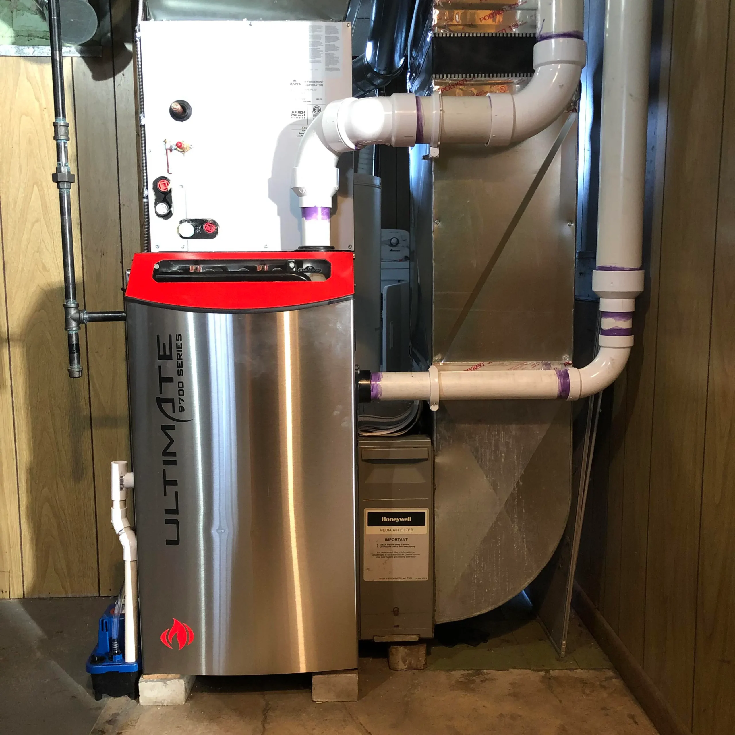 Carrier Ultimate 9700 Series furnace installed with Honeywell air filter in a Mississauga basement