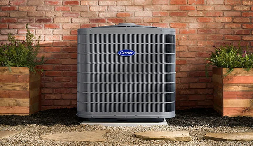 Carrier Performance Series Central Air Conditioner Installed Outdoors at a Residential Home