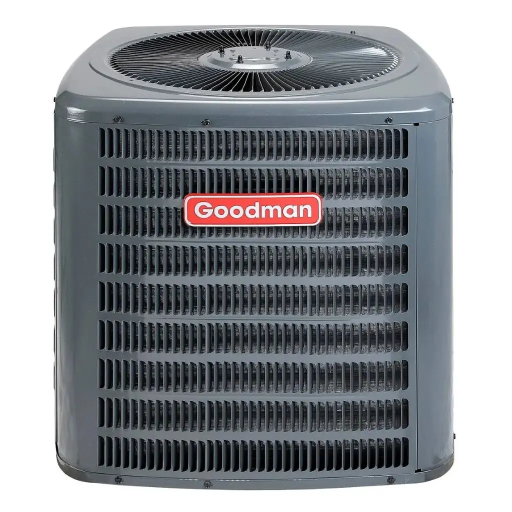 Front view of a grey Goodman GSX14 outdoor central air conditioning condenser with red logo badge